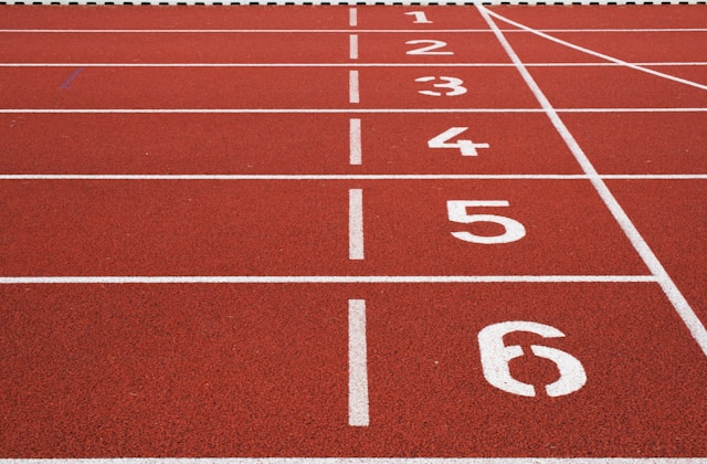 Athletes sprinting on a track during competition
